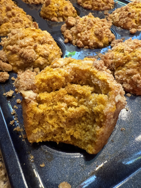 sourdough pumpkin muffin bite out of it